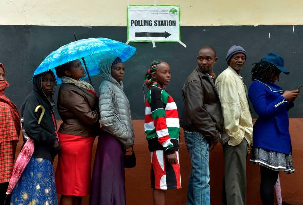 voters queing to vote voters queing to vote